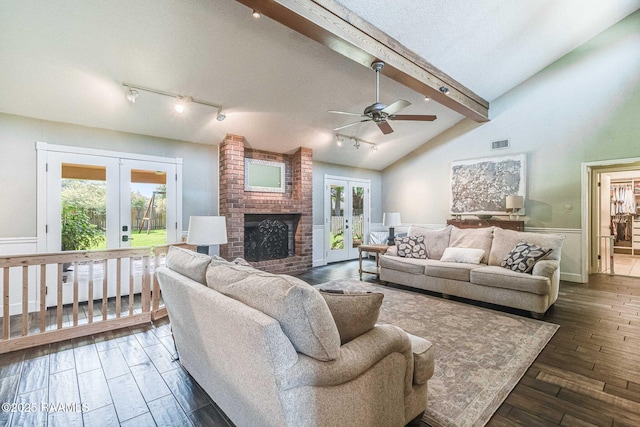 109 Bellevedere Ave, Lafayette, LA 70503 - living room with french doors, rail lighting, a fireplace, ceiling fan, and dark wood finished floors
