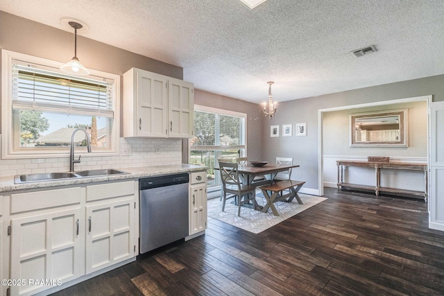 109 Bellevedere Ave, Lafayette, LA 70503 - kitchen featuring stainless steel dishwasher, a sink, white cabinetry, a chandelier, and dark wood-style flooring