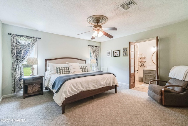 109 Bellevedere Ave, Lafayette, LA 70503 - carpeted bedroom with baseboards, a textured ceiling, ceiling fan, and ensuite bath