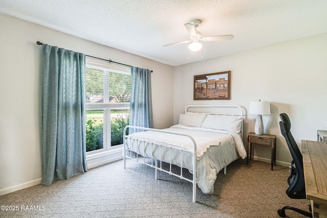 109 Bellevedere Ave, Lafayette, LA 70503 - carpeted bedroom with a textured ceiling, baseboards, and ceiling fan