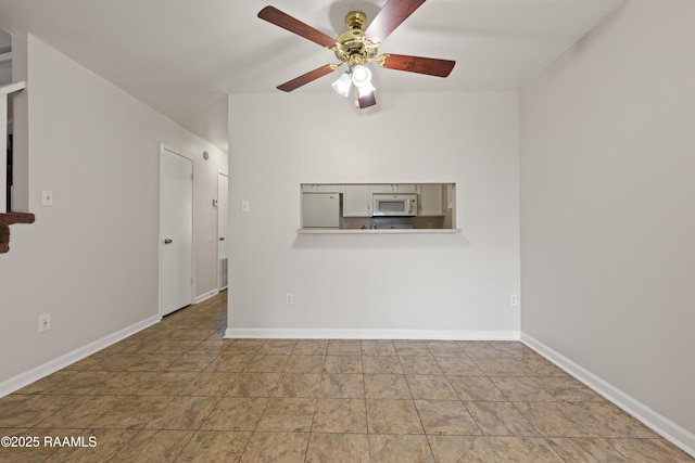 116 Southfield Pkwy, Lafayette, LA 70506 - unfurnished room featuring ceiling fan, baseboards, and stone finish flooring