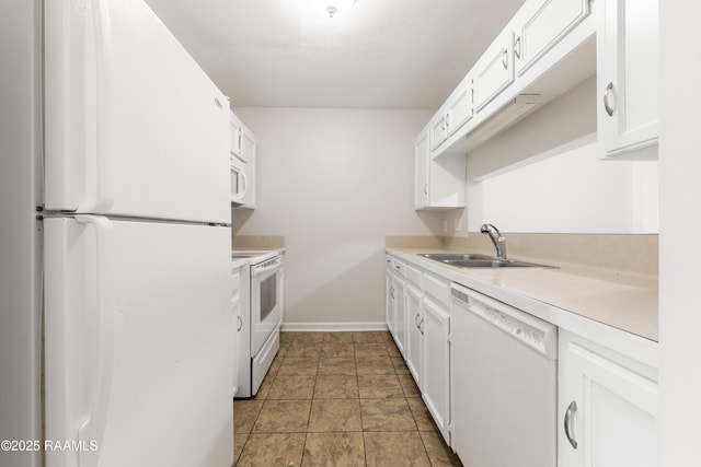 116 Southfield Pkwy, Lafayette, LA 70506 - kitchen featuring white appliances, a sink, light countertops, baseboards, and white cabinets