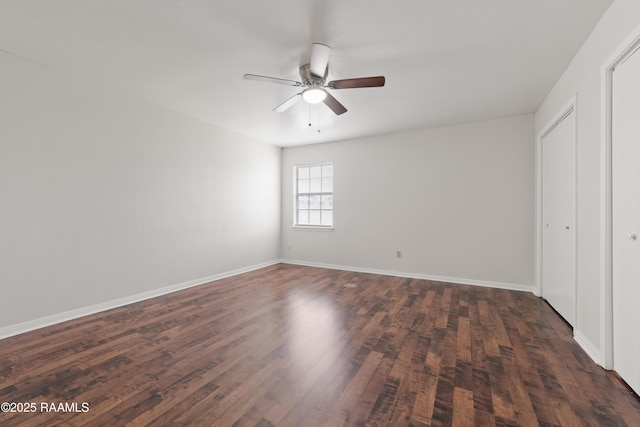 116 Southfield Pkwy, Lafayette, LA 70506 - unfurnished bedroom featuring dark wood finished floors, baseboards, and ceiling fan