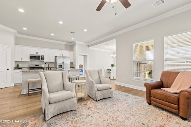 101 Micah Edward, Maurice, LA 70555 - living room featuring ceiling fan, crown molding, light wood-type flooring, recessed lighting, and baseboards