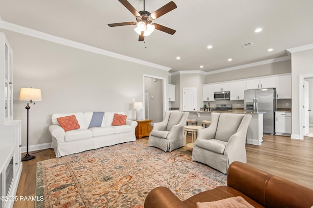 101 Micah Edward, Maurice, LA 70555 - living room with ornamental molding, a ceiling fan, light wood-style floors, recessed lighting, and baseboards