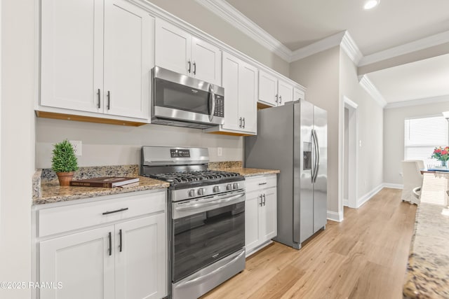 101 Micah Edward, Maurice, LA 70555 - kitchen with appliances with stainless steel finishes, crown molding, light wood-style flooring, white cabinets, and light stone countertops