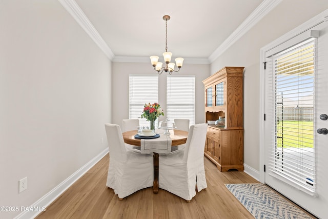 101 Micah Edward, Maurice, LA 70555 - dining space with a chandelier, ornamental molding, baseboards, light wood-style flooring, and healthy amount of natural light