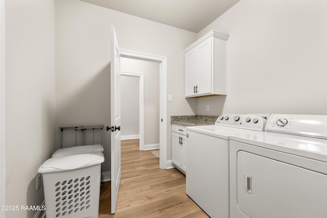 101 Micah Edward, Maurice, LA 70555 - washroom with cabinet space, light wood-style floors, washer and clothes dryer, and baseboards
