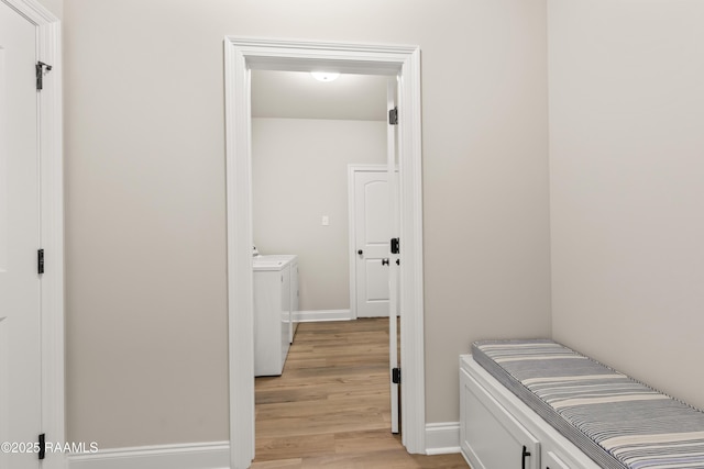 101 Micah Edward, Maurice, LA 70555 - hallway with washer and clothes dryer, light wood-style flooring, and baseboards