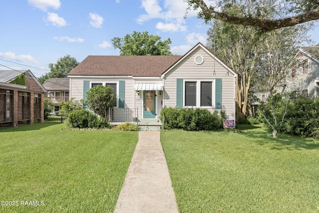 308 Boas Ave, New Iberia, LA 70563 - bungalow-style house featuring a front lawn and roof with shingles