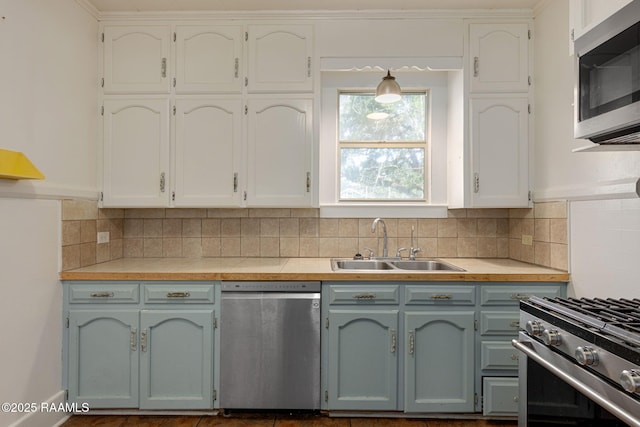 308 Boas Ave, New Iberia, LA 70563 - kitchen featuring stainless steel appliances, a sink, light countertops, and backsplash