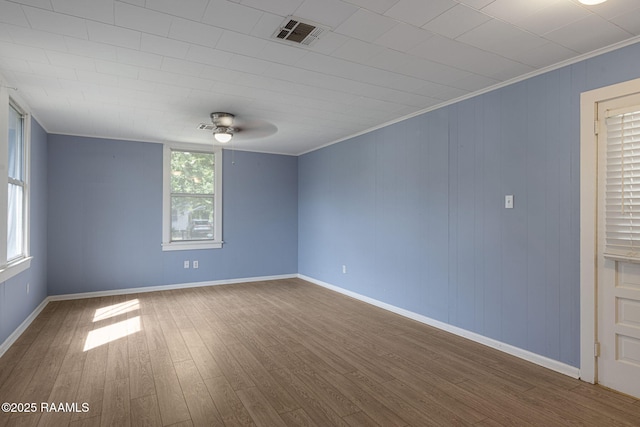 308 Boas Ave, New Iberia, LA 70563 - empty room featuring a ceiling fan, dark wood-style flooring, crown molding, and baseboards