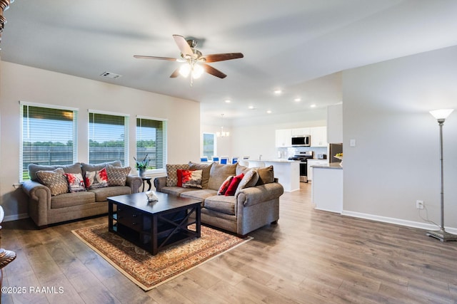 7014 Acacia Lake Dr, Maurice, LA 70555 - living area featuring light wood-style floors, a ceiling fan, baseboards, and recessed lighting
