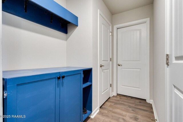 7014 Acacia Lake Dr, Maurice, LA 70555 - mudroom featuring light wood-style floors and baseboards