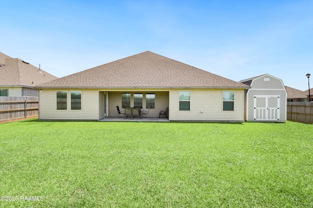 7014 Acacia Lake Dr, Maurice, LA 70555 - rear view of house featuring a storage shed, an outbuilding, a patio area, and a shingled roof
