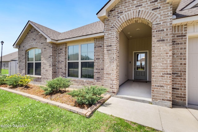7014 Acacia Lake Dr, Maurice, LA 70555 - property entrance with brick siding and a shingled roof