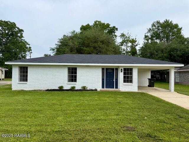single story home with driveway, a front yard, a carport, and brick siding