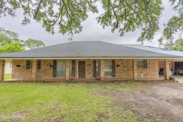 1005 Tensas Dr, Opelousas, LA 70570 - ranch-style home featuring brick siding, a front lawn, and roof with shingles