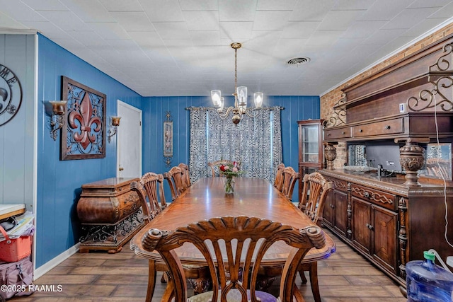 1005 Tensas Dr, Opelousas, LA 70570 - dining space with a chandelier, light wood-style flooring, and baseboards