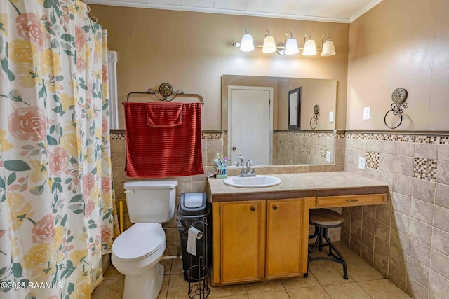 1005 Tensas Dr, Opelousas, LA 70570 - bathroom featuring tile walls, tile patterned flooring, toilet, ornamental molding, and vanity