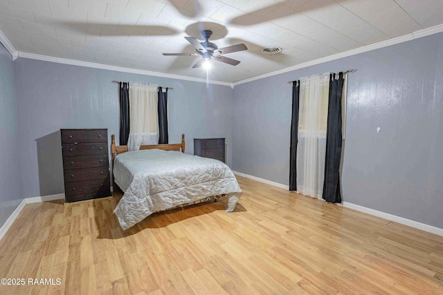 1005 Tensas Dr, Opelousas, LA 70570 - bedroom with light wood-style flooring, crown molding, and ceiling fan