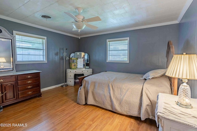 1005 Tensas Dr, Opelousas, LA 70570 - bedroom featuring multiple windows, light wood finished floors, ornamental molding, and a ceiling fan