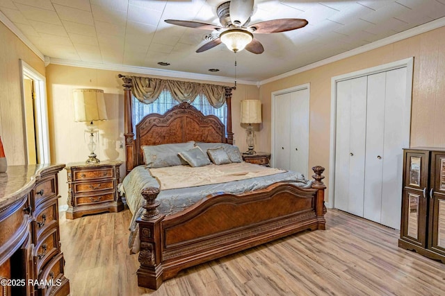 1005 Tensas Dr, Opelousas, LA 70570 - bedroom with light wood finished floors, two closets, crown molding, and ceiling fan