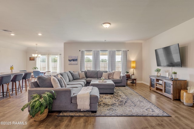 110 Casa Bella Ct, Breaux Bridge, LA 70517 - living area with a chandelier, wood finished floors, and recessed lighting