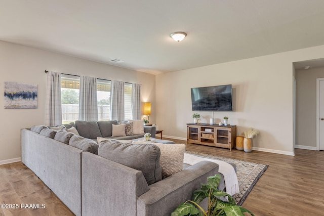 110 Casa Bella Ct, Breaux Bridge, LA 70517 - living room featuring wood finished floors and baseboards