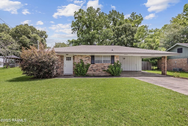 164 Mimosa Pl, Lafayette, LA 70506 - view of front of house with brick siding, an attached carport, driveway, and central AC unit