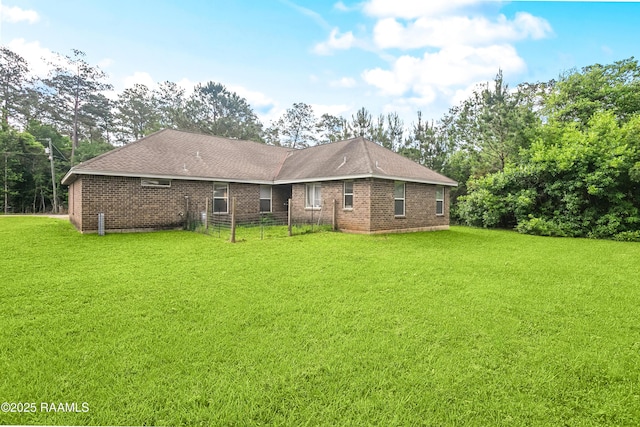 4306 Holly Dr, Slidell, LA 70461 - back of property featuring brick siding and a shingled roof