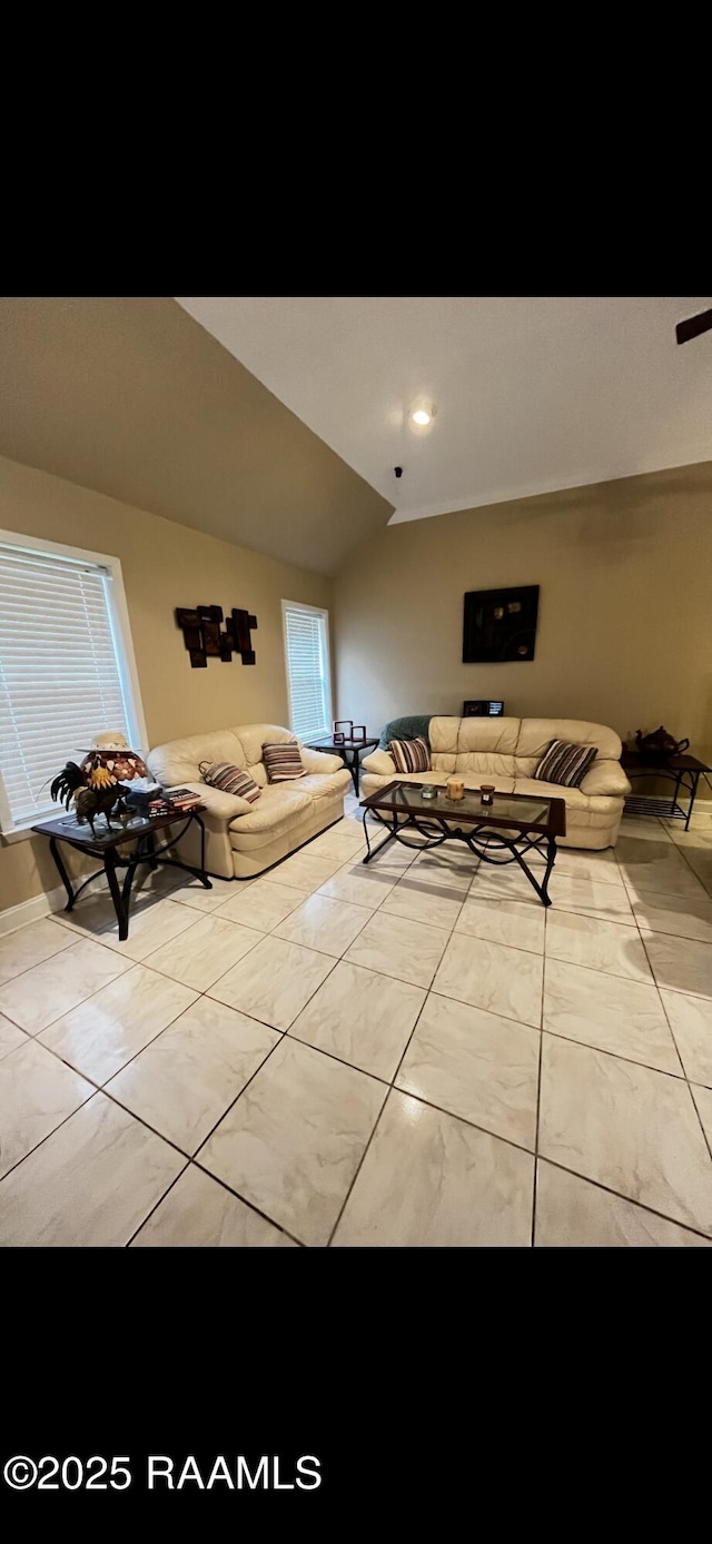 4306 Holly Dr, Slidell, LA 70461 - living area featuring vaulted ceiling and light tile patterned floors