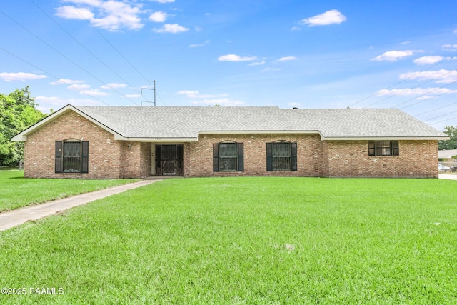506 Rice Ln, Opelousas, LA 70570 - ranch-style house featuring a front lawn, roof with shingles, and brick siding
