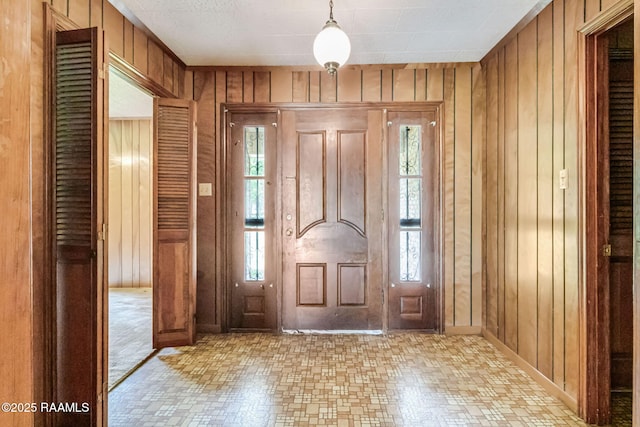 506 Rice Ln, Opelousas, LA 70570 - entrance foyer featuring wood walls and baseboards