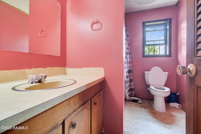 506 Rice Ln, Opelousas, LA 70570 - full bathroom featuring vanity, toilet, a textured ceiling, and a shower with shower curtain