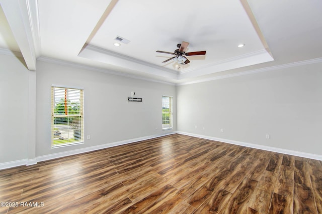 102-104 Trout Ct, Dulac, LA 70353 - spare room featuring a tray ceiling, a ceiling fan, dark wood-style floors, ornamental molding, and baseboards