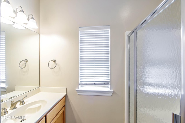102-104 Trout Ct, Dulac, LA 70353 - bathroom featuring healthy amount of natural light, a shower stall, and vanity
