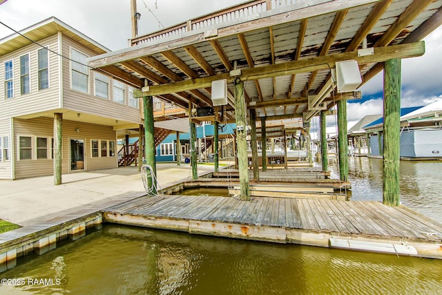 102-104 Trout Ct, Dulac, LA 70353 - dock featuring a water view and a patio