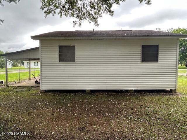 143 Monette St, Ville Platte, LA 70586 - view of side of property with a carport