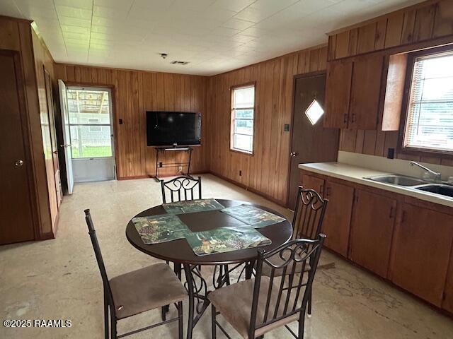 143 Monette St, Ville Platte, LA 70586 - dining space with plenty of natural light and wood walls