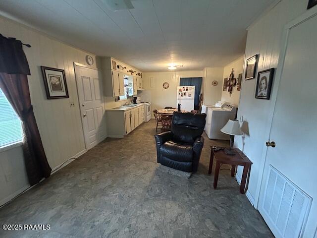 143 Monette St, Ville Platte, LA 70586 - kitchen with freestanding refrigerator and light countertops