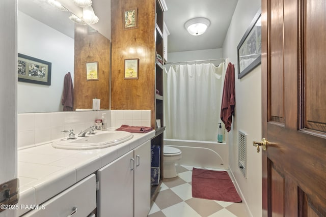 10154 Willow Crest Rd, Abbeville, LA 70510 - bathroom featuring tile patterned floors, vanity, toilet, and shower / tub combo
