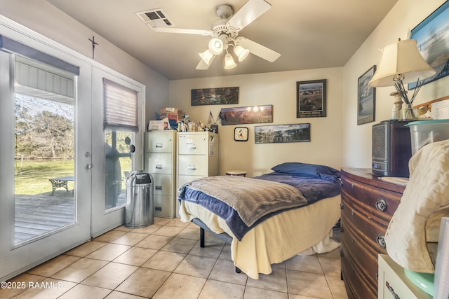 10154 Willow Crest Rd, Abbeville, LA 70510 - bedroom featuring access to exterior, light tile patterned flooring, and ceiling fan