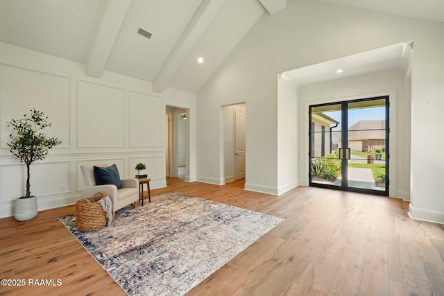 108 Meadowbrook Dr, Broussard, LA 70518 - sitting room with high vaulted ceiling, beam ceiling, light wood finished floors, recessed lighting, and a decorative wall