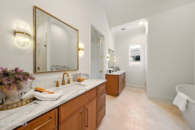 108 Meadowbrook Dr, Broussard, LA 70518 - bathroom featuring two vanities and a freestanding bath