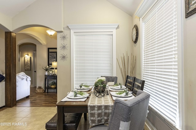 100 Mirada Ln, Lafayette, LA 70508 - dining space with lofted ceiling, arched walkways, and wood finished floors