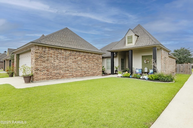 100 Mirada Ln, Lafayette, LA 70508 - view of front facade featuring driveway, roof with shingles, brick siding, and a garage