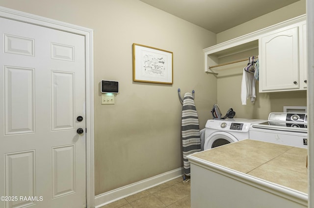 100 Mirada Ln, Lafayette, LA 70508 - laundry room with cabinet space, washing machine and clothes dryer, baseboards, and light tile patterned flooring