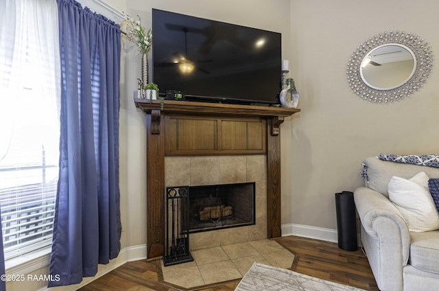 100 Mirada Ln, Lafayette, LA 70508 - living area with baseboards, a tiled fireplace, and wood finished floors