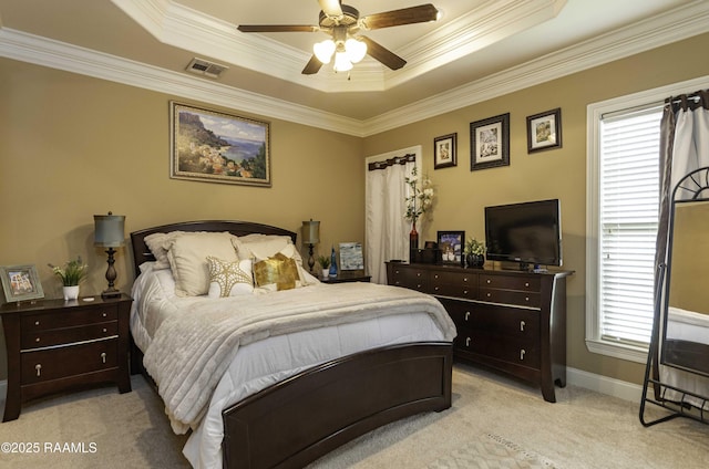 100 Mirada Ln, Lafayette, LA 70508 - bedroom featuring light carpet, a tray ceiling, crown molding, baseboards, and ceiling fan